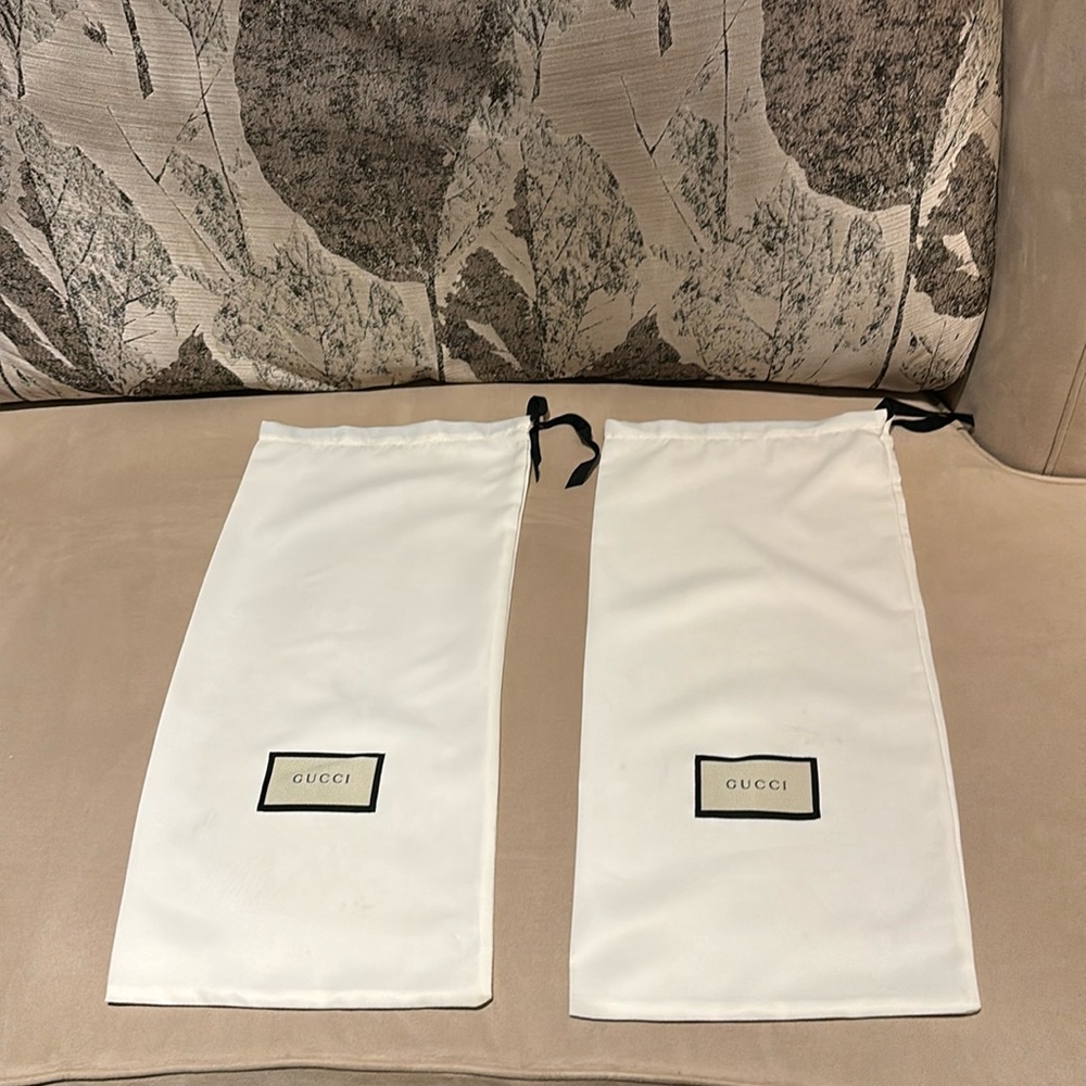 A set of Gucci shoe bags